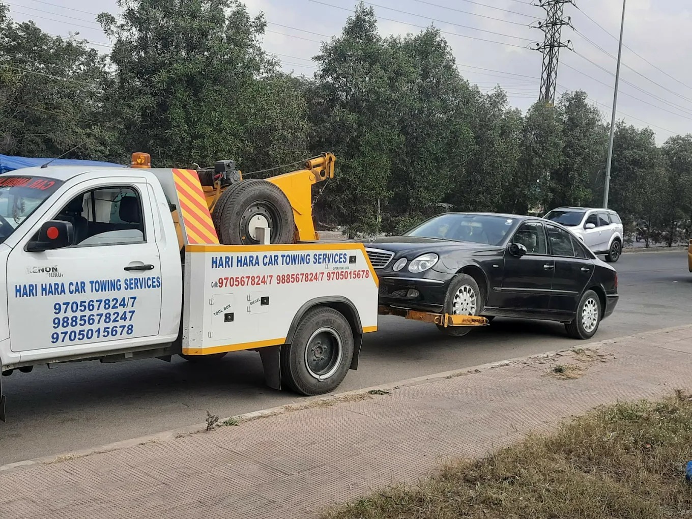 Luxury car towing service with specialised equipment